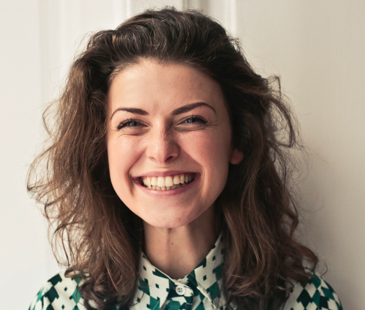 young woman with bright, vibrant smile